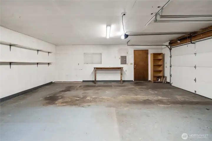 Oversized 2-car garage has plenty of room for storage, workshop, or extra vehicles.