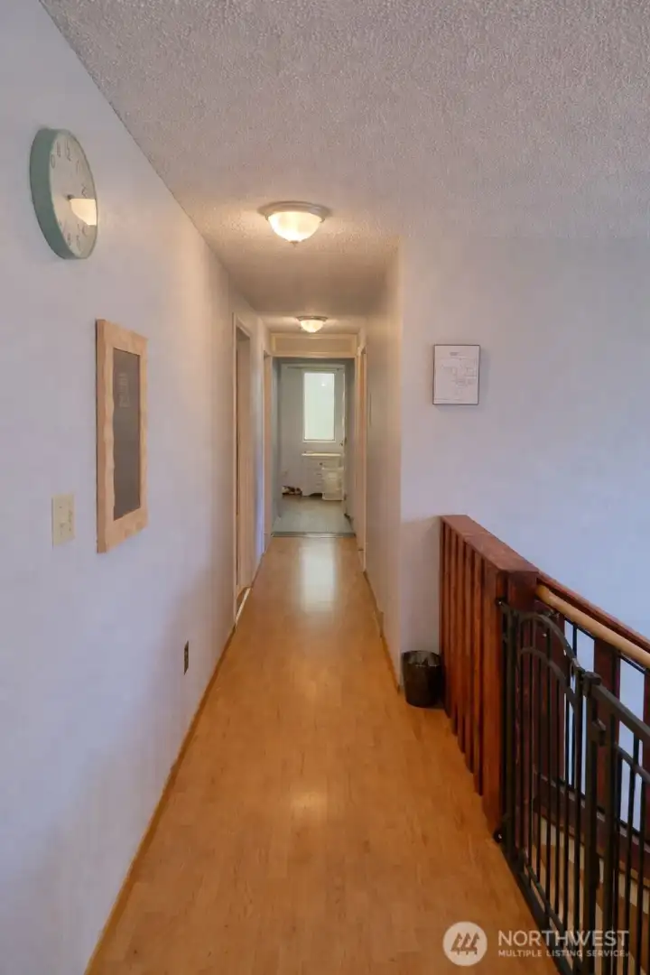 Aisle at the upper level leading to bedrooms
