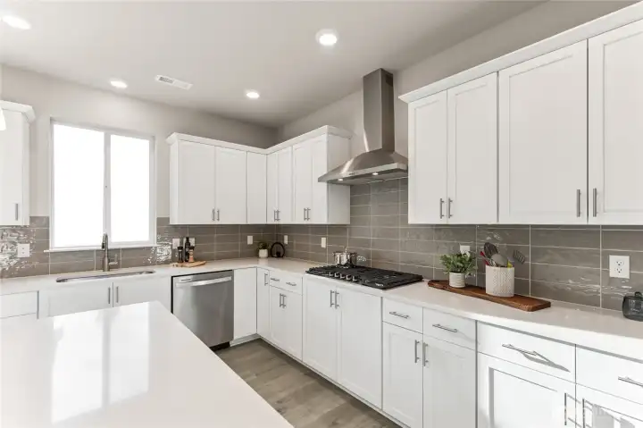 Gas 5 burner cook top. Photo rendering is representational and may be virtually staged. Actual home is under construction and finishes, elevation, and paint colors may vary. See site agent for details. Gas 5 burner cook top. Photo rendering is representational and may be virtually staged. Actual home is under construction and finishes, elevation, and paint colors may vary. See site agent for details.