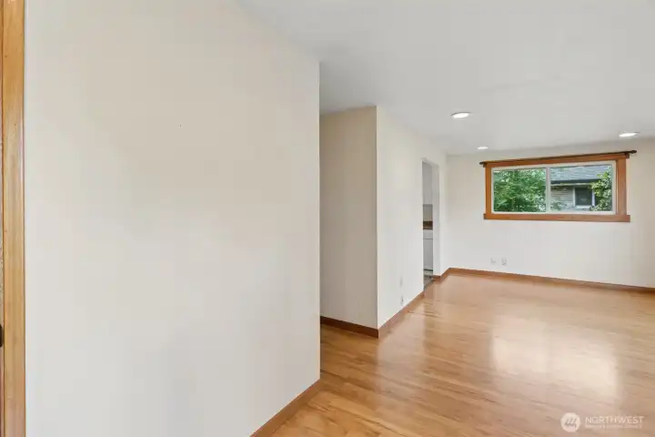 Bright and inviting living area featuring hardwood flooring, neutral colors, and an open flow that creates a comfortable everyday living space. Bright and inviting living area featuring hardwood flooring, neutral colors, and an open flow that creates a comfortable everyday living space.