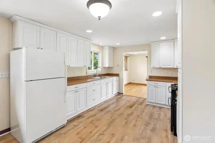 kitchen featuring ample cabinetry, generous counter space, and included appliances for move-in ready convenience. kitchen featuring ample cabinetry, generous counter space, and included appliances for move-in ready convenience.