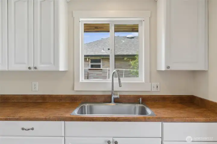 Kitchen sink overlooks the property while natural light enhances the bright and functional workspace. Kitchen sink overlooks the property while natural light enhances the bright and functional workspace.