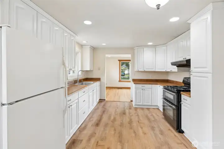 Galley-style kitchen provides excellent storage, workspace, and direct access to the home's main living areas. Galley-style kitchen provides excellent storage, workspace, and direct access to the home's main living areas.