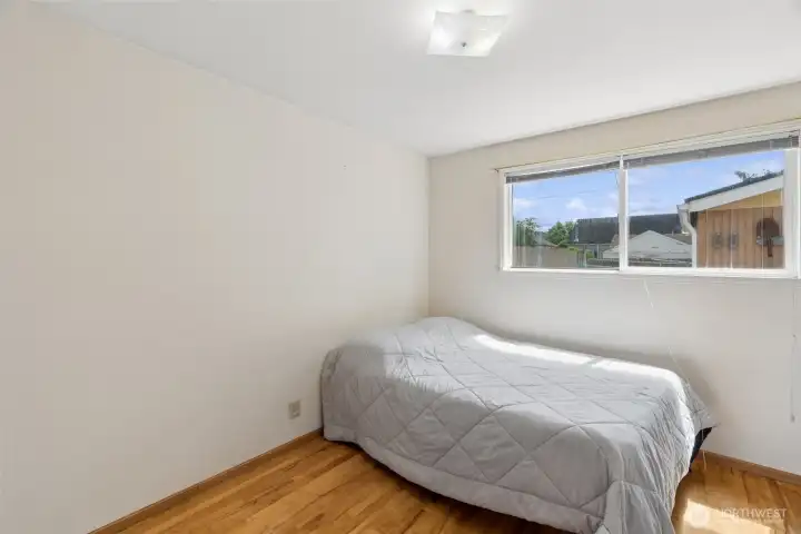 Secondary bedroom offers flexibility for guests, a home office, hobby room, or additional living space. Secondary bedroom offers flexibility for guests, a home office, hobby room, or additional living space.