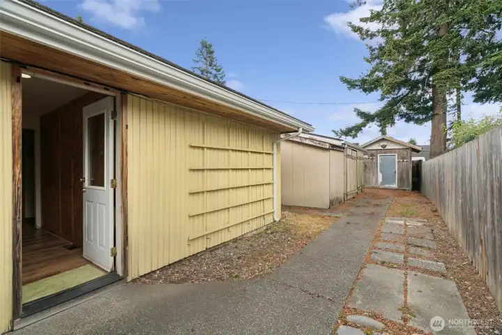 Side yard and walkway provide convenient access around the property with space for storage and outdoor use. Side yard and walkway provide convenient access around the property with space for storage and outdoor use.