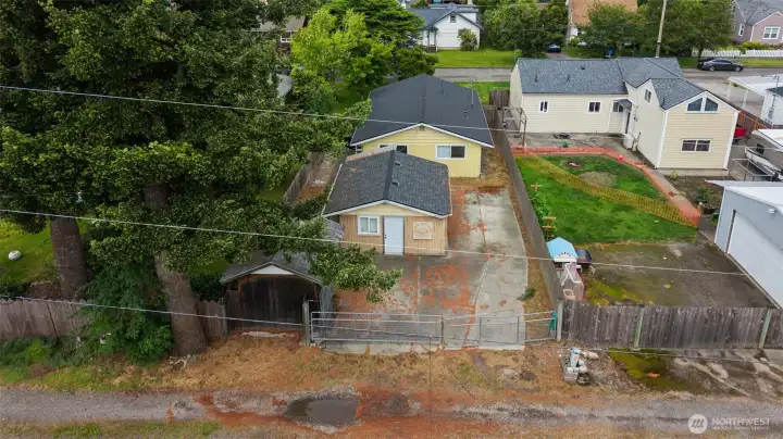 Aerial perspective showcasing the property's generous backyard, privacy, and convenient location in the growing Enumclaw real estate market. Aerial perspective showcasing the property's generous backyard, privacy, and convenient location in the growing Enumclaw real estate market.
