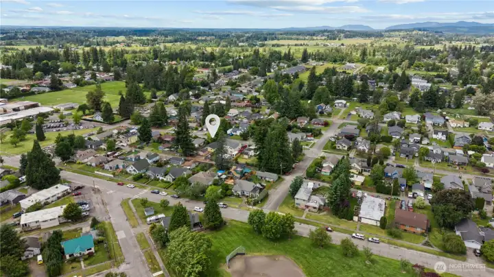 Bird's-eye neighborhood perspective showcasing the established residential setting and proximity to local amenities that make Enumclaw one of King County's most desirable small-town communities. Bird's-eye neighborhood perspective showcasing the established residential setting and proximity to local amenities that make Enumclaw one of King County's most desirable small-town communities.