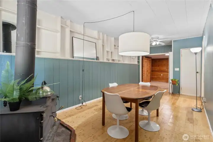 Large dining room has cozy wood burning stove.
