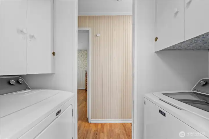 Main level laundry, washer and dryer stay.