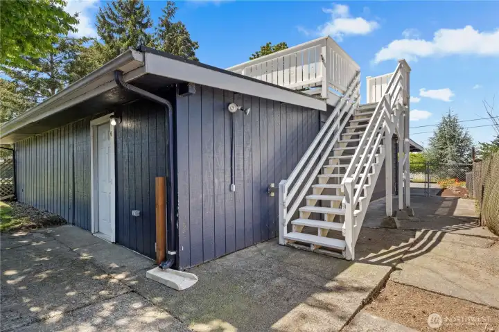 Rooftop deck is also accessible by exterior stairs.