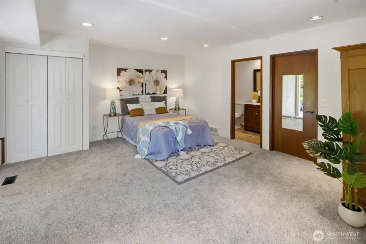 Lower level 2nd Primary Suite with ensuite bathroom and access to private backyard patio