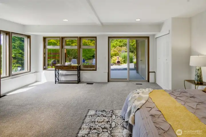Expansive 2nd Primary Suite on lower level with private backyard covered patio