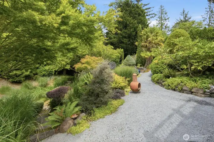 Stunning meandering pathways, private seating areas, and gardens galore!