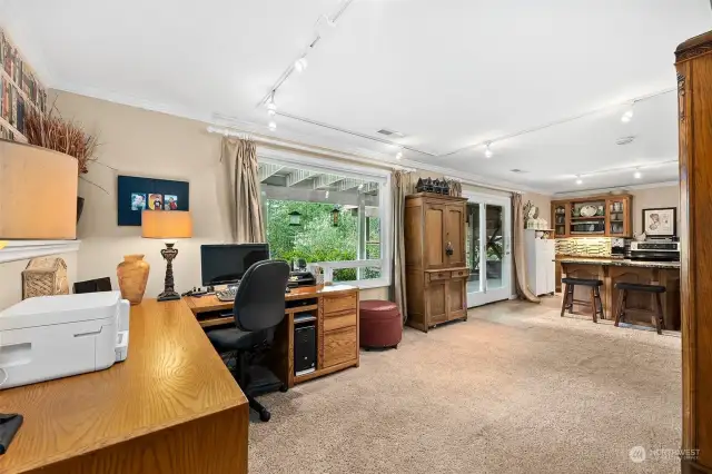 Basement flex space with French doors to patio and deck