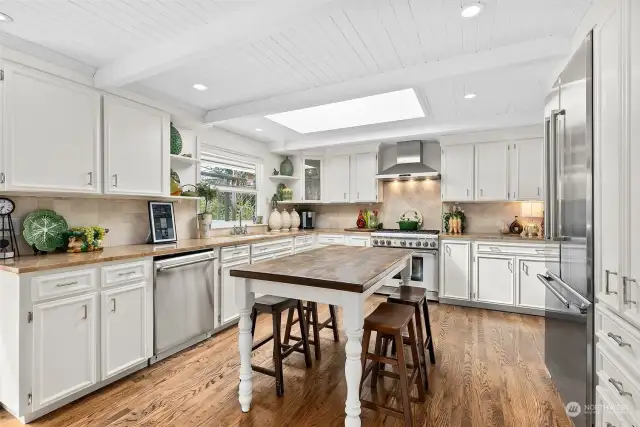 Kitchen with slab marble countertops and backsplash