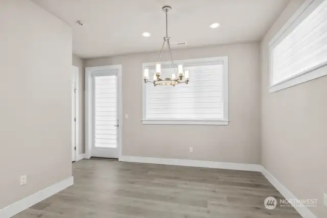 Dining room open to the patio with the huge covered Trex deck which spans the full width of the home.