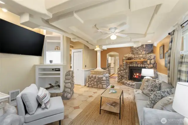 Spacious living room with cozy fireplace.