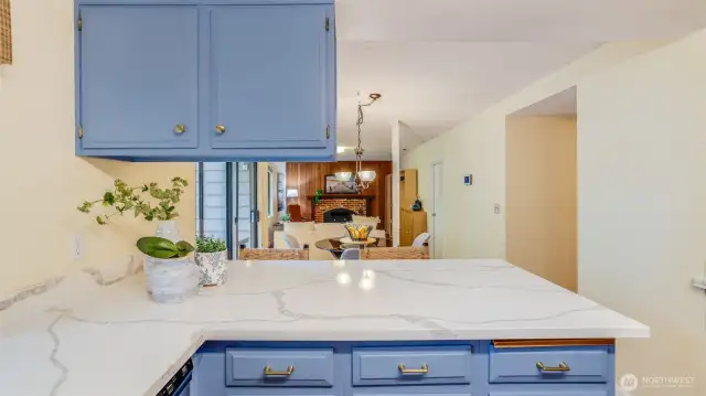 Open sight lines from the kitchen to the den making this layout feel open and inviting.