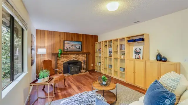 Enjoy cozy nights in around this wood burning fireplace. Shelving stays too!