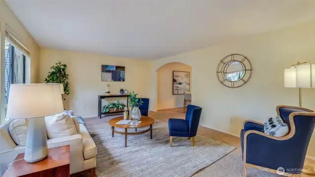 Formal living room offers a cozy space for entertaining or to unwind after a long day.