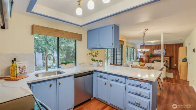 You will love spending time in this stylish kitchen with trendy blue cabinets, granite counters, gold fixtures and all stainless steel appliances.