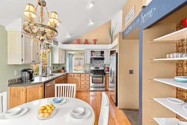 Here's the daily eating area and open pantry-style shelving.
