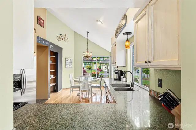 This shot was taken from the "pass-through window" from the more formal dining area.  What a great way to pass food and dishes through to the larger dining table !