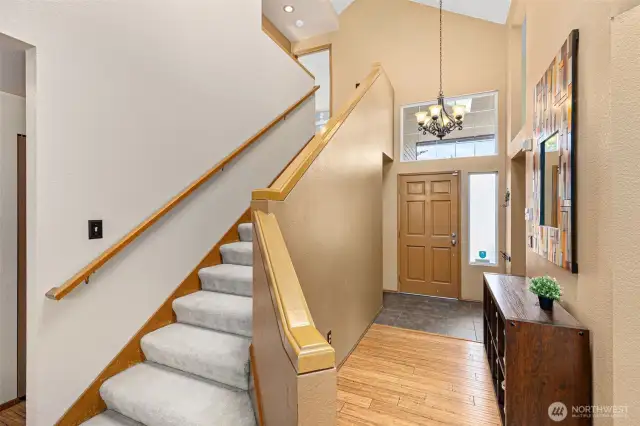 Looking from the living room back to the stairs and entryway.