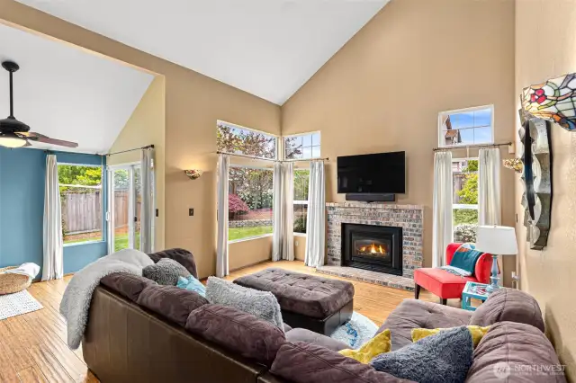This open floor plan is a serious win! Dining area on the left, door to backyard, gas fireplace & room for large furniture.