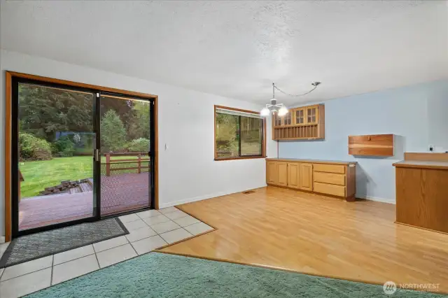Custom built ins would make a functional coffee nook, or buffet table for the eat in kitchen.