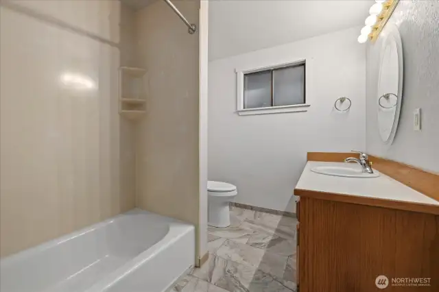 Full shared bathroom and guest bathroom is in main hallway.