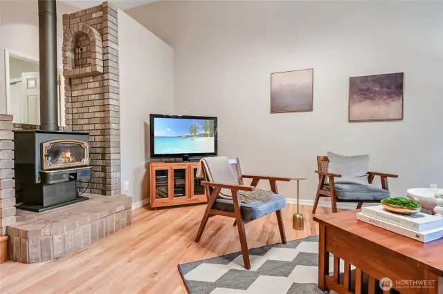 Warm living room with wood burning fireplace