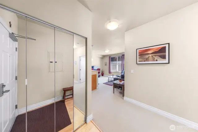 High-ceilinged open kitchen/living area.