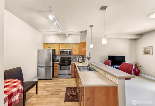 Convenient breakfast bar for morning beverages and room for a table in the kitchen.