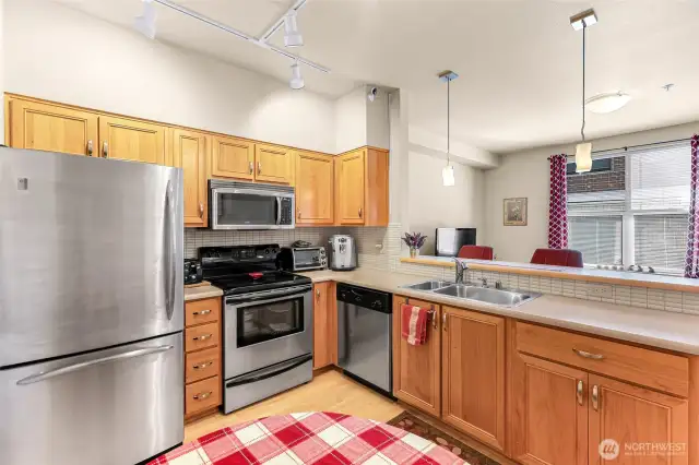 Practical well-laid out kitchen with view to living room.