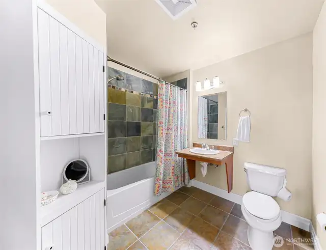 Slate tub/shower surround in primary bath.