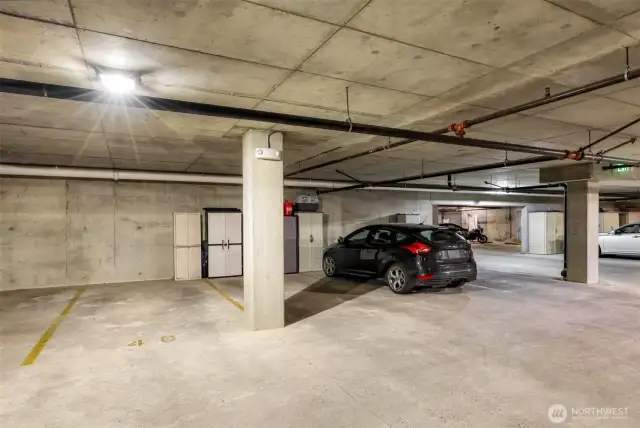 Take elevator down to designated space 40 in secured parking garage with room for storage cabinet.