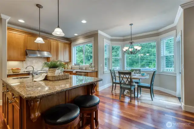 Look at the beautiful crown molding, ornate corbels on the island and detailed window trim.
