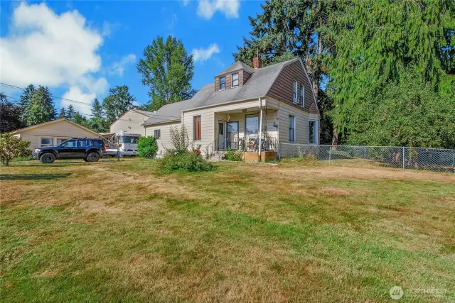 Partially fenced, 2 car garage and 2800sqft large building that houses an 1800 sqft ADU with parking and a shop