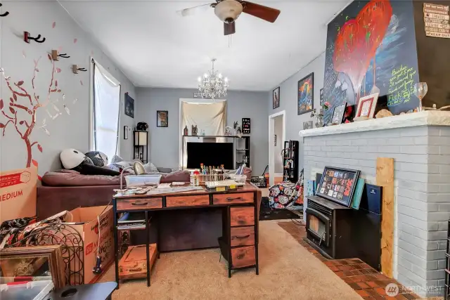 view of living room from dining room. Pellet stove to the right works great.