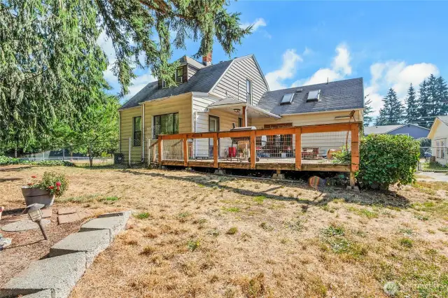 Back of main house with nice sized deck. Skylights bring in a lot of light