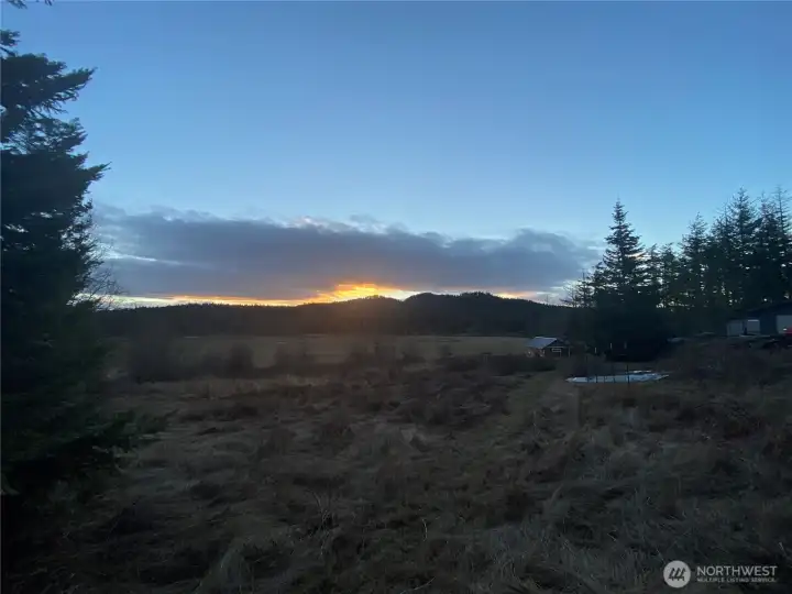 Sunrise behind Sunset Mountain to the southeast welcoming the day.