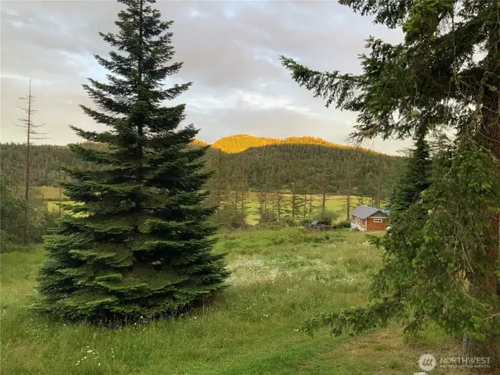 Sunset Mountain to the southeast lit up and the end of the day. This property boast sunrise and sunset colors every day.