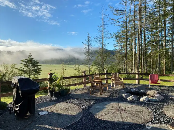 The patio boasts a bbq area, fire pit, wood shed, picnic area and a breathtaking view to be relished. Looking south/southeast.
