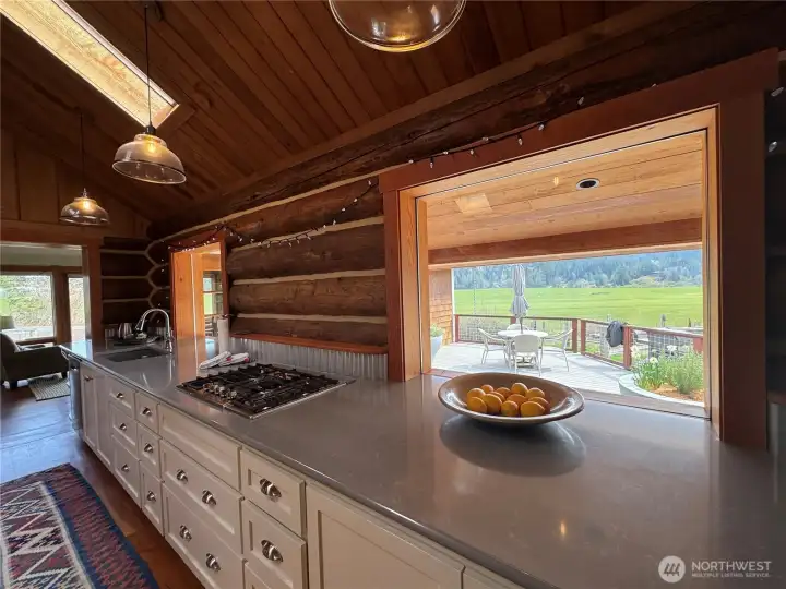 Propane cook top with down draft. Custom built, this deep counter top is ______ feet in length.
