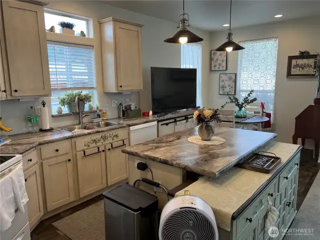 Another view of the kitchen and eating bar.
