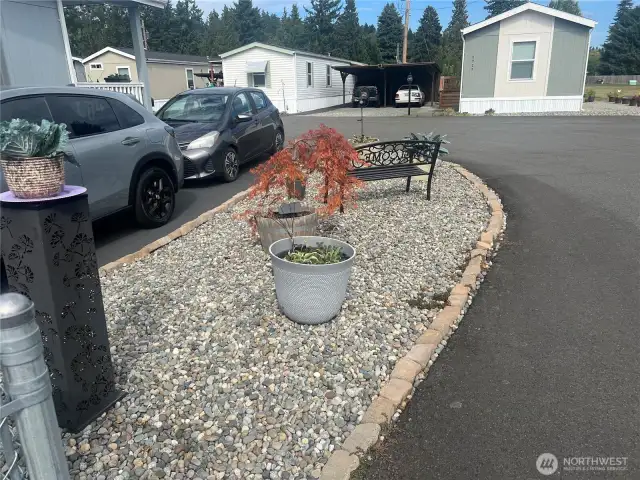 Side of driveway.