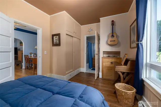 Built-in closet in the main floor bedroom.  Dining room through door on left, ensuite bath through door at back of room.