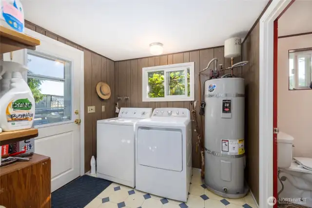 Laundry room w/another half-bath downstairs.  Door at left leads to deck area.