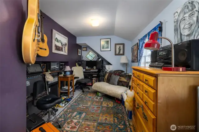 Currently used as a music room, this is one of several guest bedroom options upstairs.